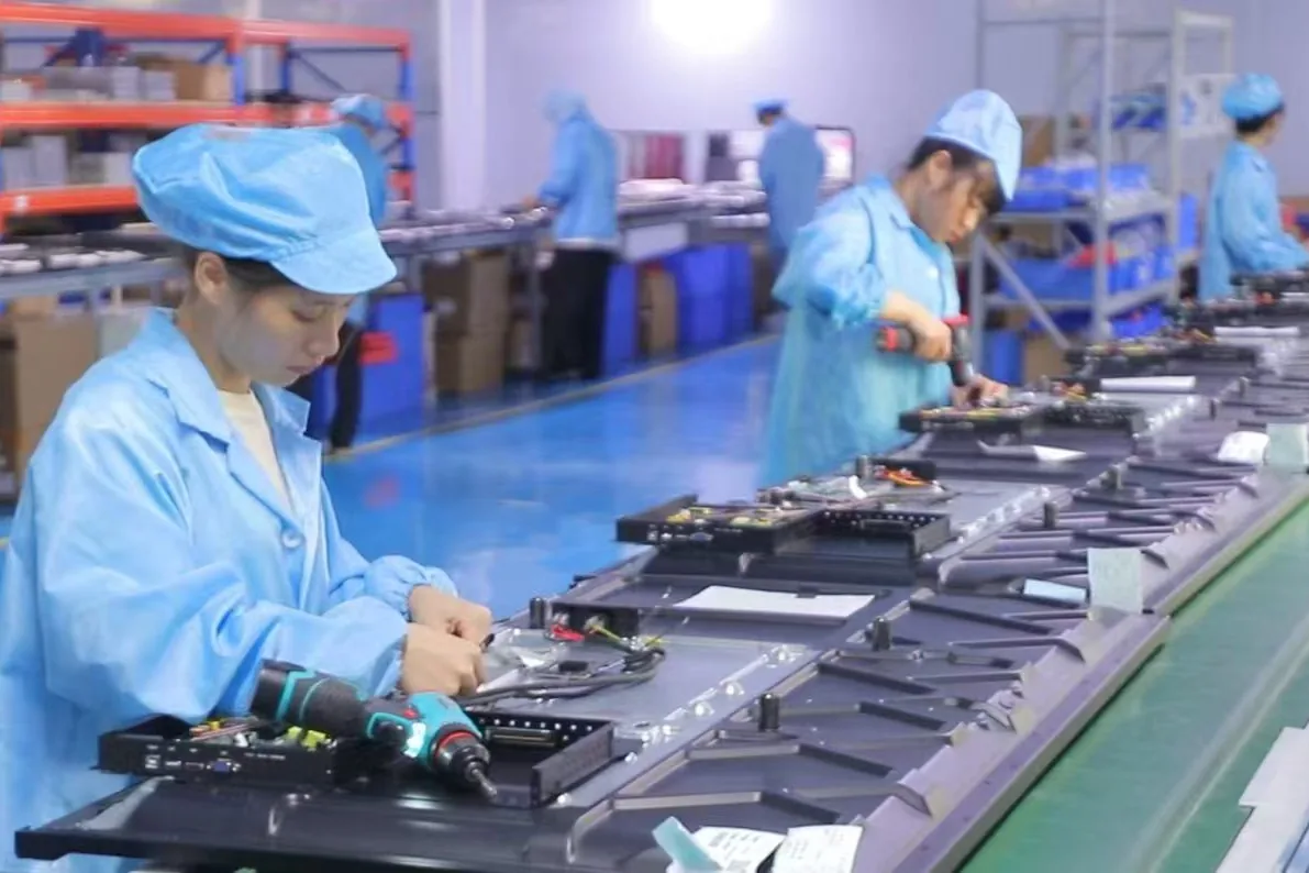 Tralltech interactive flat panel assembly line