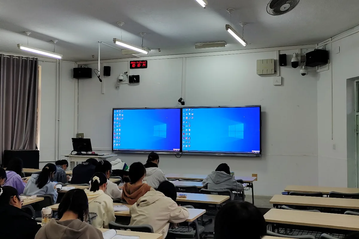 Students in a smart classroom using Tralltech interactive flat panels