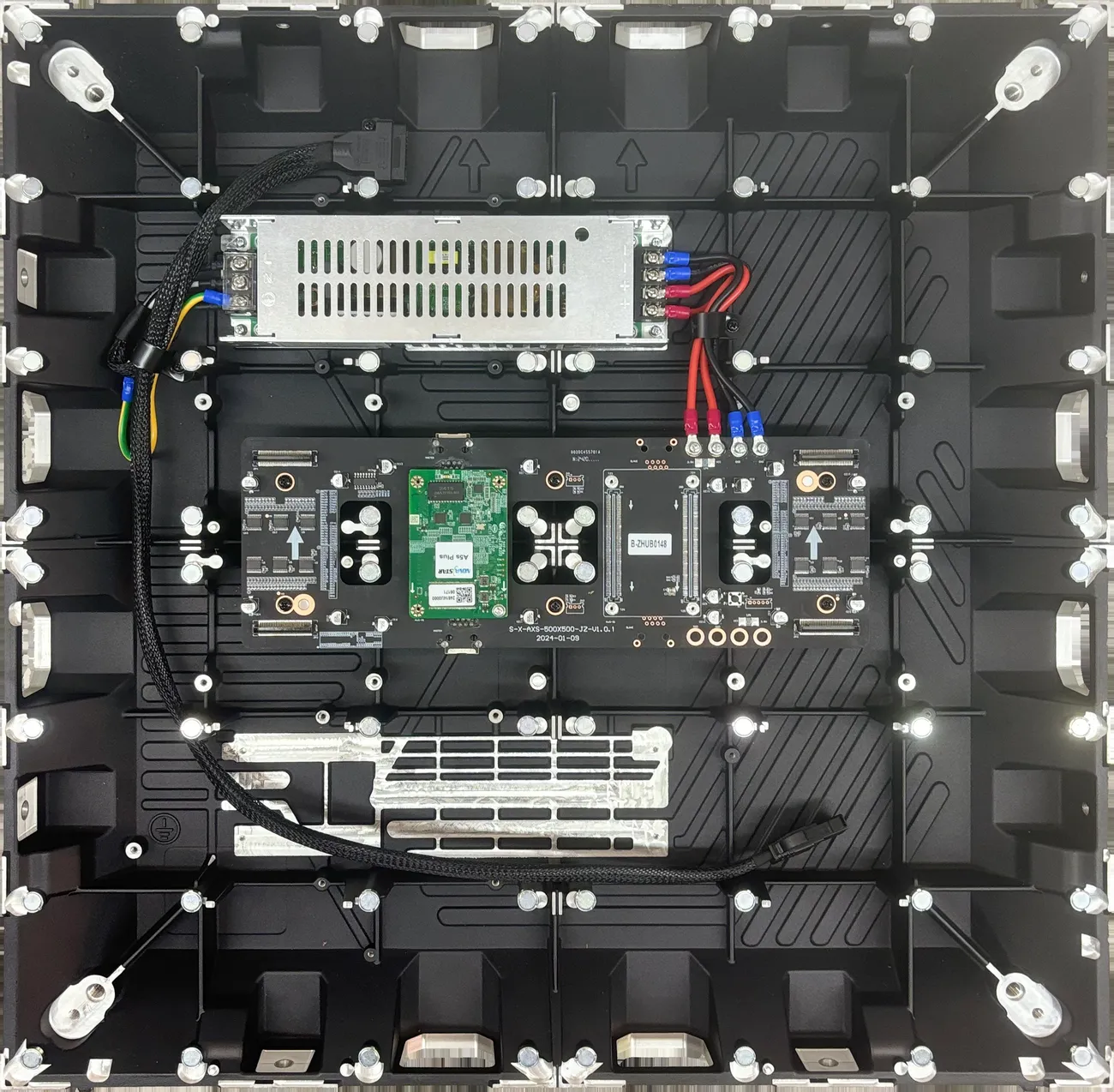 Factory reference photo of modular LED cabinet internal power supplies and receiving card wiring